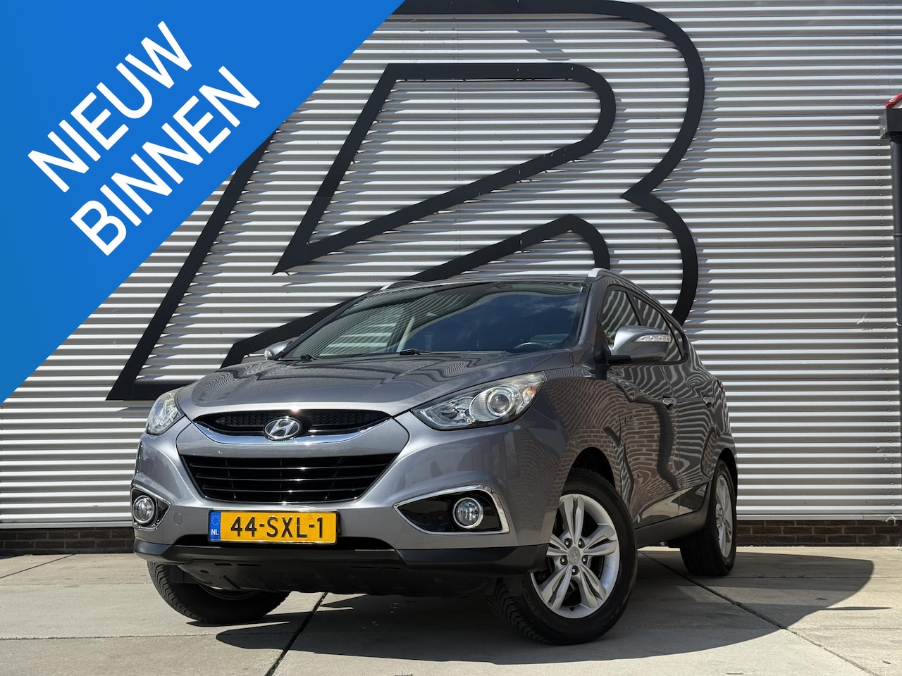 Hyundai ix35 - 1.6i GDI Style 2e Eigenaar|Trekhaak|PDC|Clima|Cruise|N.A.P|APK tot 11-2026 - AutoWereld.nl