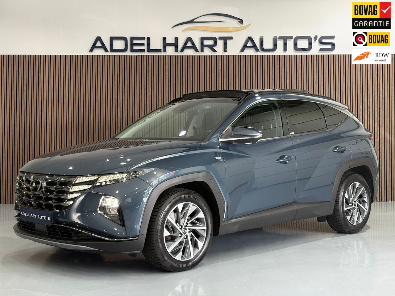 Hyundai Tucson - 1.6 T-GDI MHEV Comfort / Panorama dak / Navigatie full map / Camera / Adaptive Cruise - AutoWereld.nl