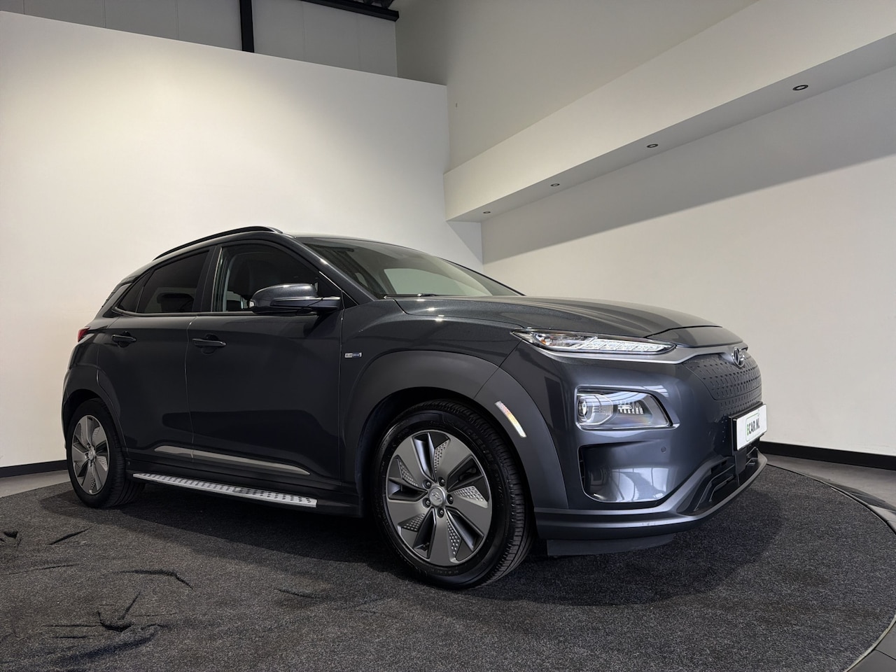 Hyundai Kona Electric - EV Premium 64 kWh | Voorstoelen verwarmd & gekoeld | Trekhaak | Warmtepomp | Soh (batterij - AutoWereld.nl