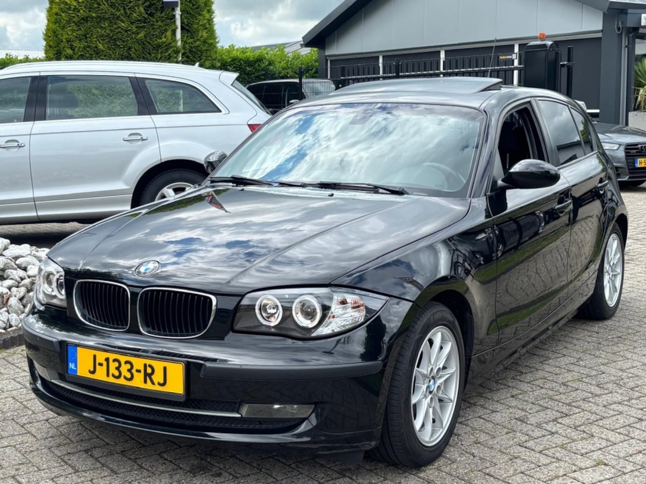 BMW 1-serie - 116i Executive Sport 5-Deurs 2008 Schuifdak Zwart - AutoWereld.nl