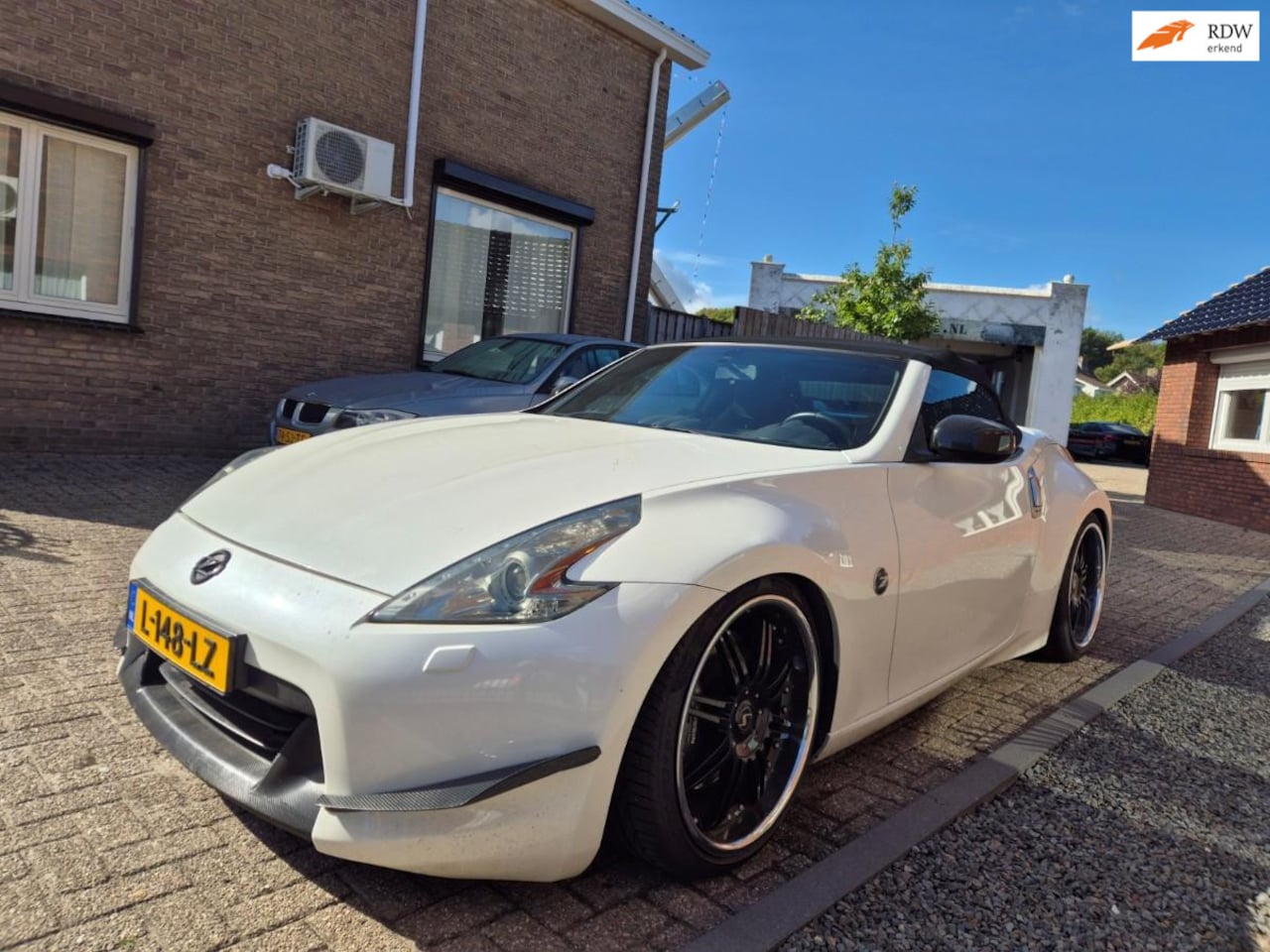 Nissan 370Z Roadster - 3.7 V6 Pack Stillen Supercharged - AutoWereld.nl