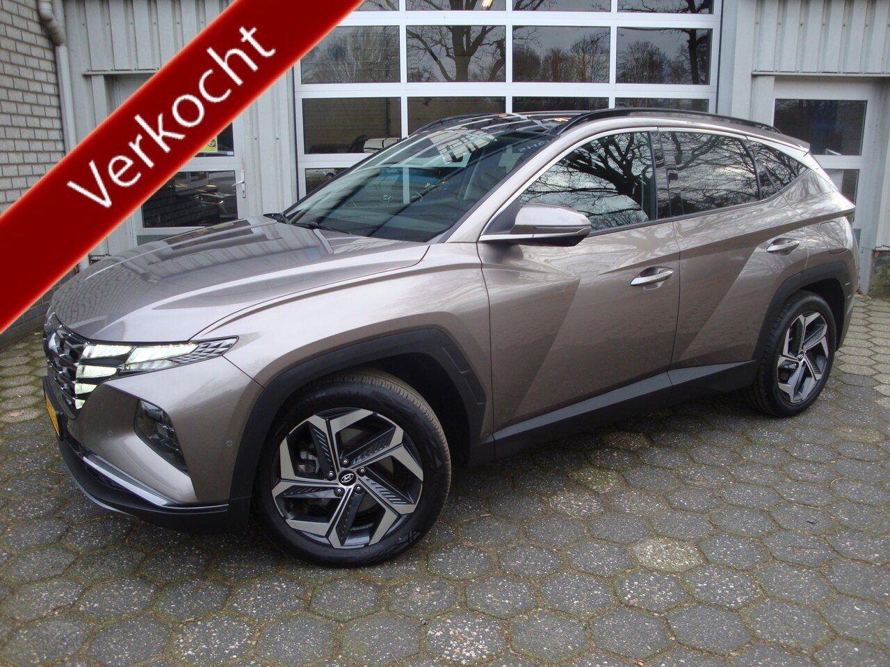 Hyundai Tucson - 1.6 T-GDI PHEV Premium Sky 4WD / Panoramadak/ Trekhaak - AutoWereld.nl