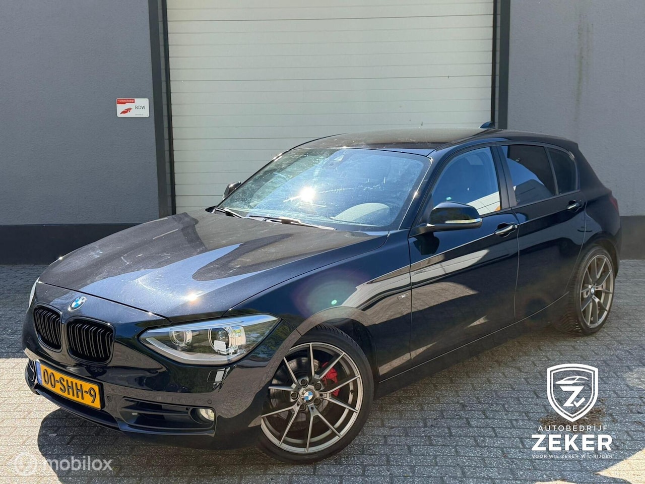 BMW 1-serie - 118i Sport Line / automaat / nap / navi / cruise - AutoWereld.nl
