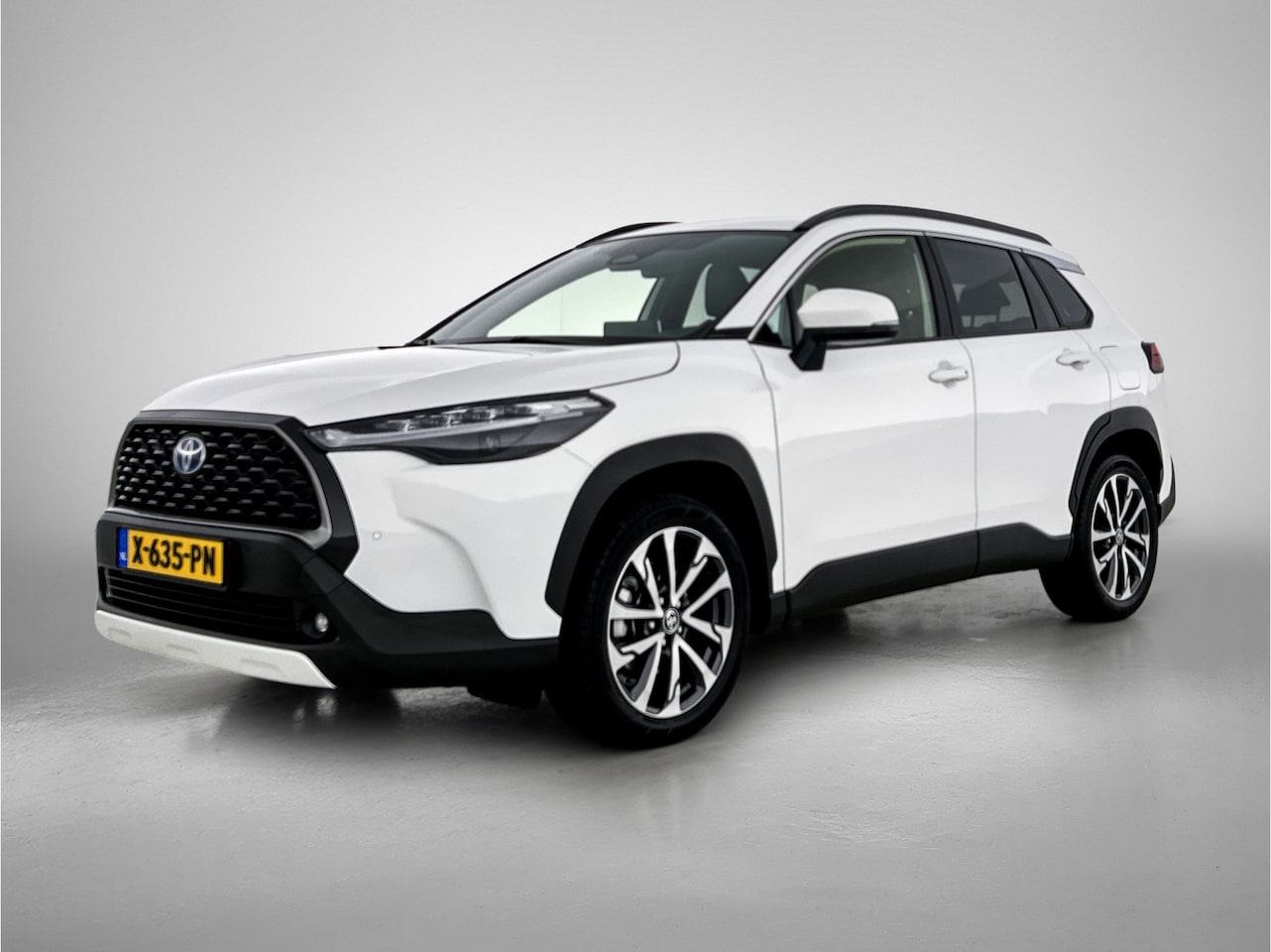 Toyota Corolla Cross - Hybrid 200 Style, trekhaak, half leder, stoelverwarming - AutoWereld.nl