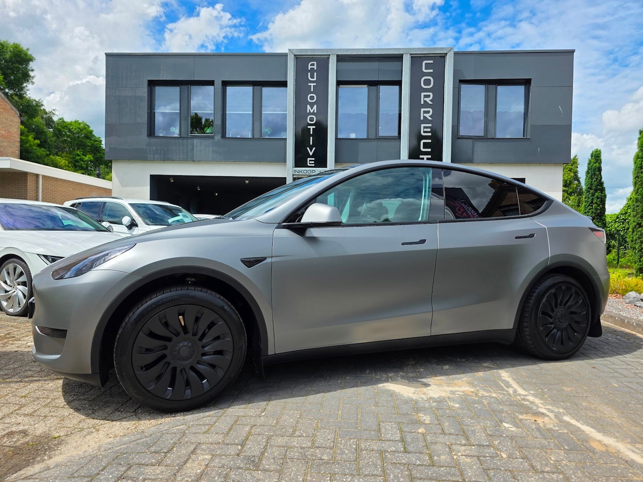 Tesla Model Y - RWD 58 kWh Custom Wrap. 1ste eigenaar! - AutoWereld.nl