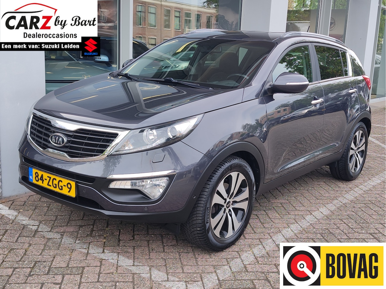Kia Sportage - 2.0 SUPER PACK AUTOMAAT Xenon | Stoelverwarming | Cruise | TREKHAAK - AutoWereld.nl