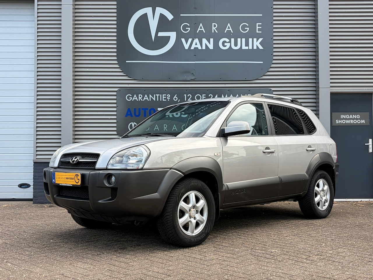 Hyundai Tucson - 2.0i Dynamic 141PK Trekhaak,Airco,Cruise,ElektrRamen+Spiegels,Isofix,Radio/Cd-Speler,Dakra - AutoWereld.nl