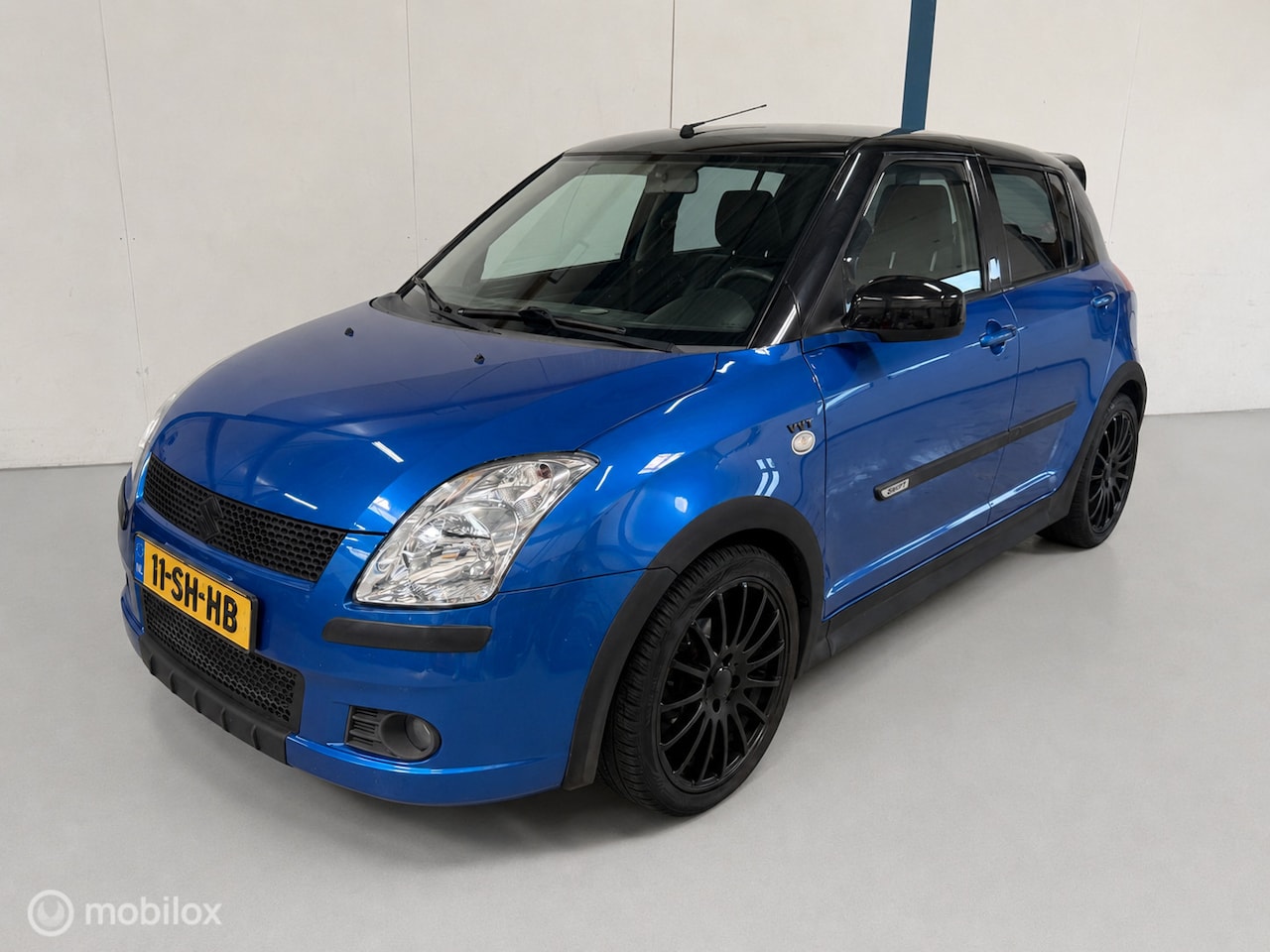 Suzuki Swift - 1.5 GLS 5-DRS / LEER / AIRCO - AutoWereld.nl