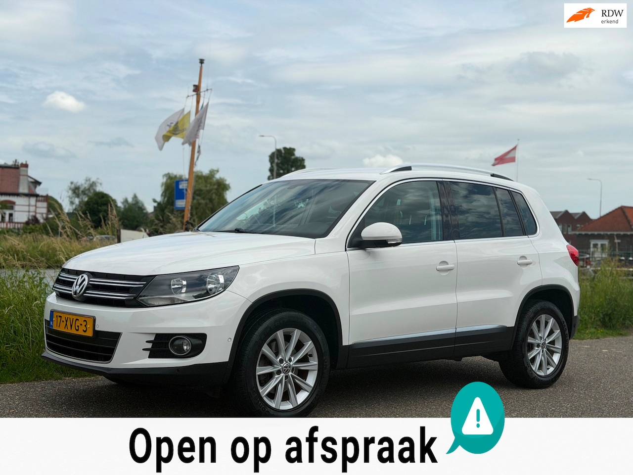 Volkswagen Tiguan - 2.0 TDI Sport&Style 4Motion DSG 1E EIG CLIMA CRUISE TREKHAAK - AutoWereld.nl