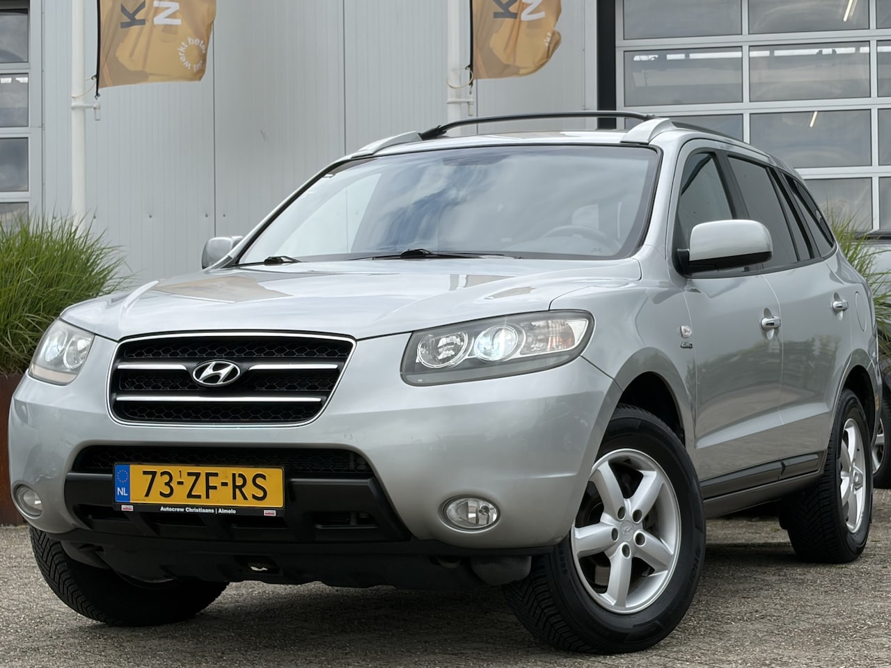 Hyundai Santa Fe - 2.7i V6 4WD Style 190pk | 7-Persoons | Automaat | Bluetooth | Cruise control | DAB | Elect - AutoWereld.nl