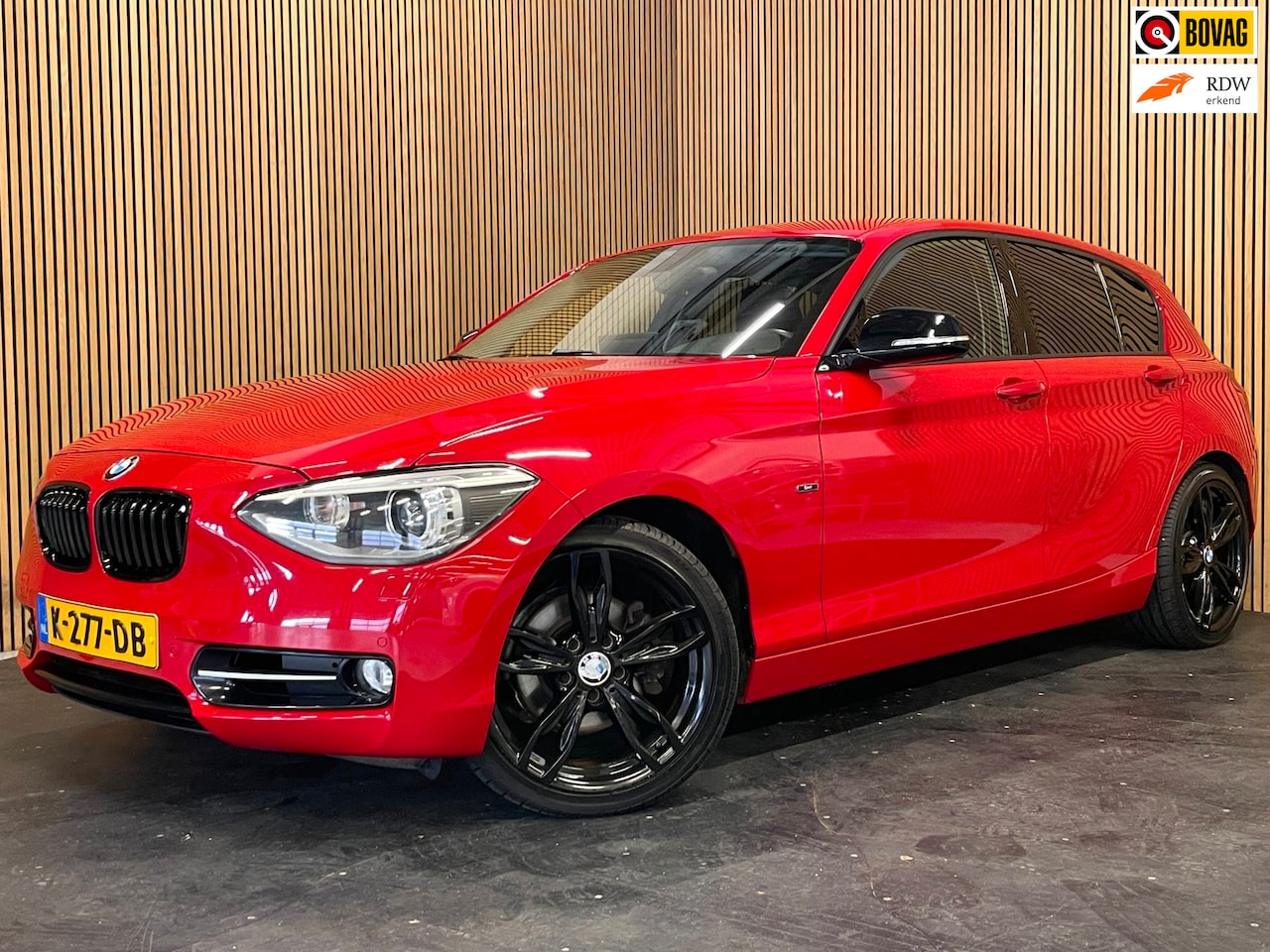 BMW 1-serie - 118i Business+|BLACK-RED EDITION|M-SPORT|AUTOMAAT|APPLE CARPLAY/ANDROID AUTO|NAVI|CLIMA+CR - AutoWereld.nl