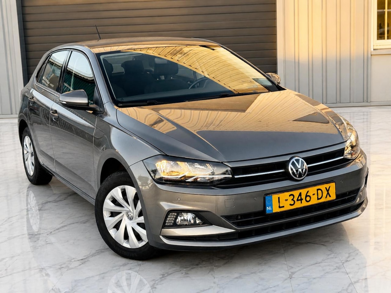 Volkswagen Polo - 1.0 TSI Comfortline Carplay/Navi/PDC - AutoWereld.nl