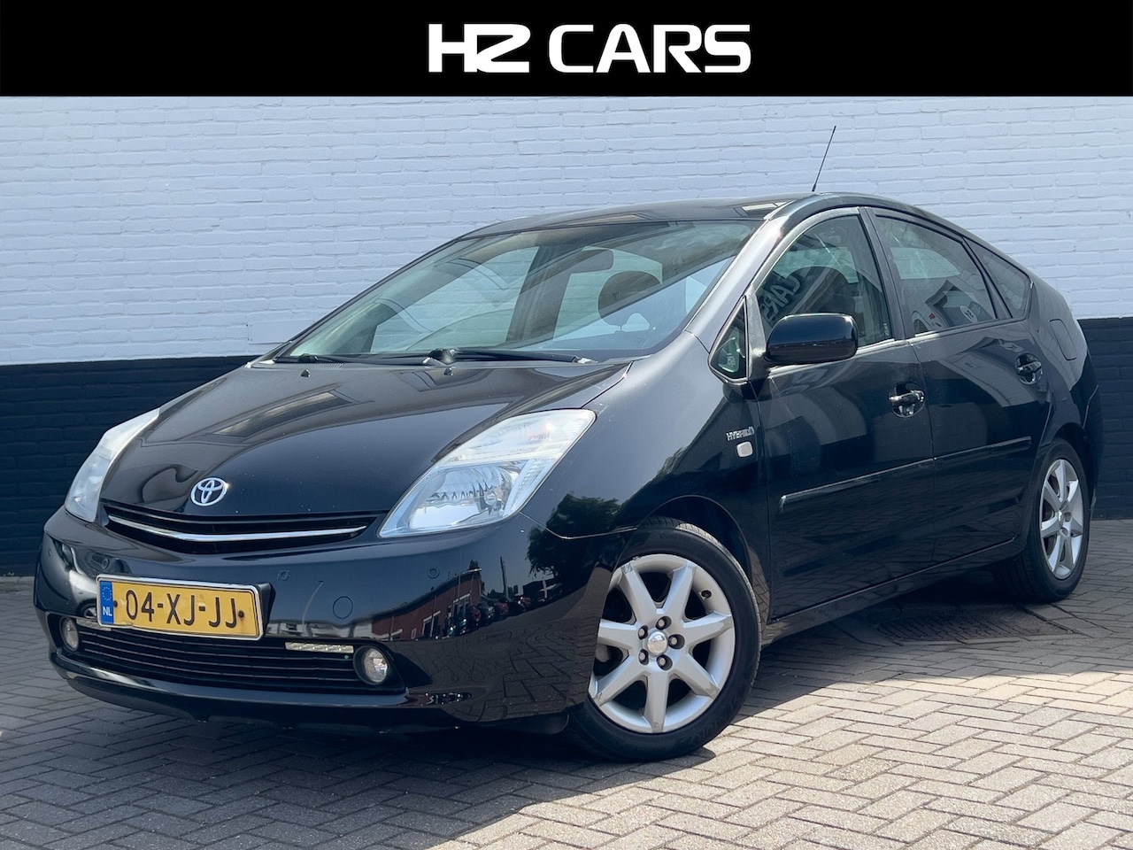 Toyota Prius - 1.5 VVT-i Business Edition/Leder/Cruise/Clima/JBL/PDC/Keyless - AutoWereld.nl