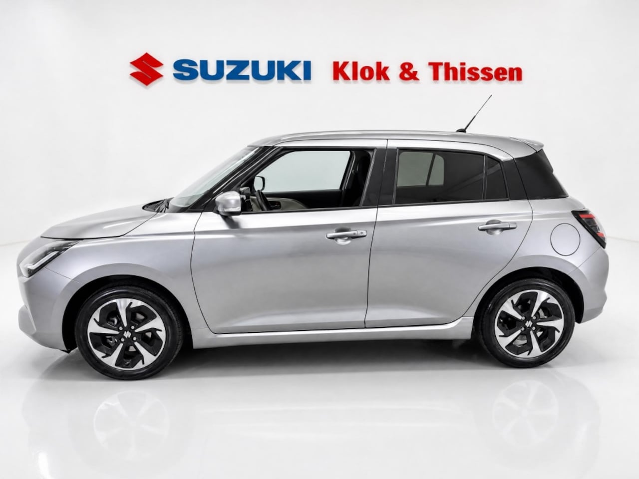 Suzuki Swift - fabrieksgar. t/m 17-09-2028 1.2 Style Smart Hybr Navi LMV CC Apple/Android Clima PDC - AutoWereld.nl
