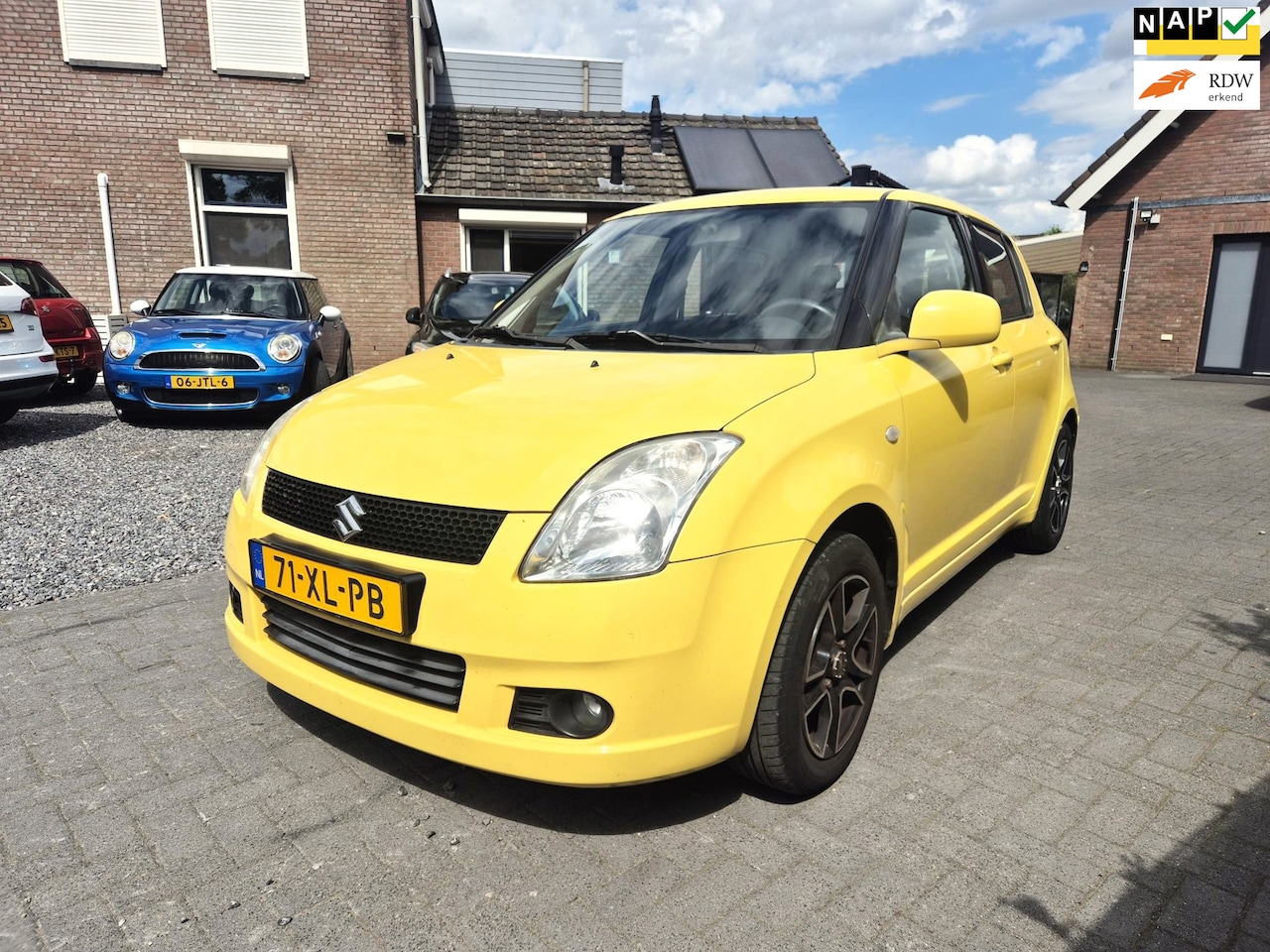 Suzuki Swift - 1.3 Shogun 5 Deurs Airco Sportvelgen Trekhaak - AutoWereld.nl