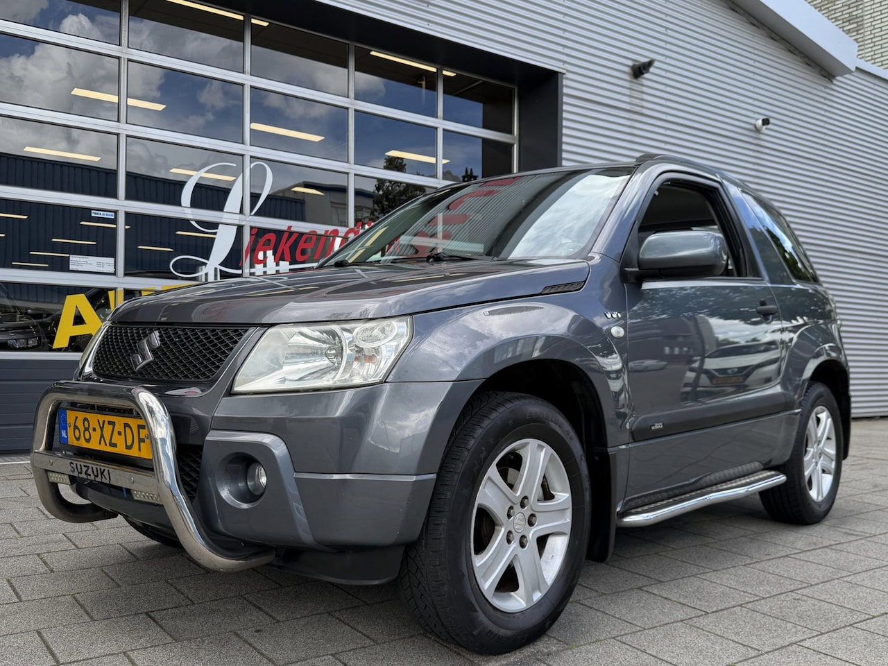 Suzuki Grand Vitara - 1.6-16V JLX - Airco I Comfort pakket I Bull bar & Side bar I Sport velgen I - AutoWereld.nl