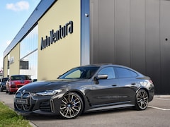 BMW i4 - M50 High Executive 84 kWh | M-sport | Harman Kardon | Schuif-/kantel Dak | Head-Up | Adapt