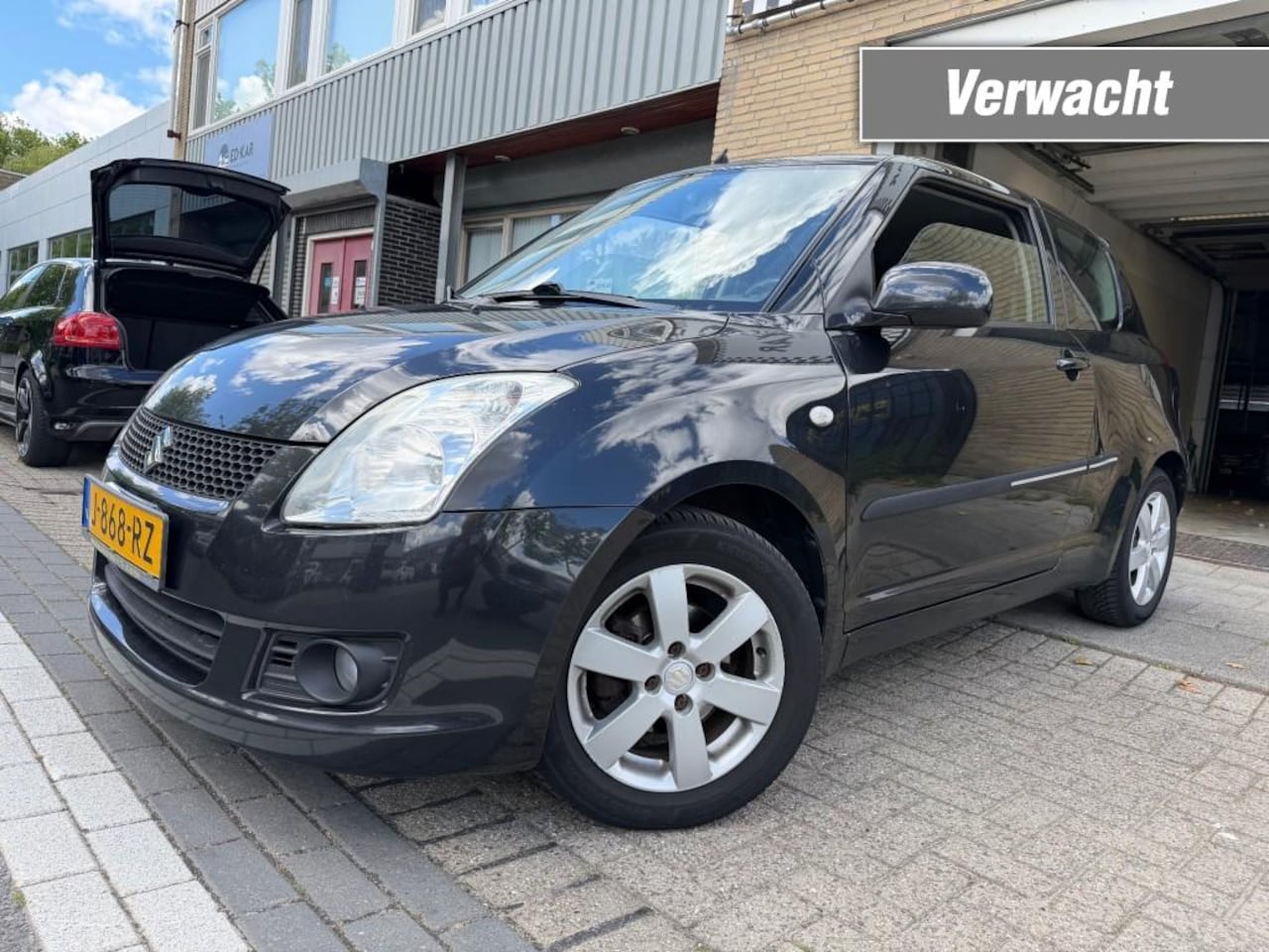 Suzuki Swift - 1.3 Bandit CLIMA NAVI LMV STOELVERW. NETTE AUTO RIJD GOED APK 12-2026 - AutoWereld.nl