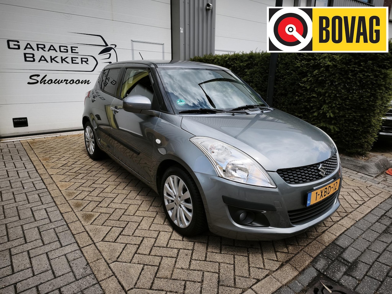 Suzuki Swift - 1.2 Exclusive EASSS Airco Cruise-Control Stoelverwarming Bluetooth Eerste Eigenaar - AutoWereld.nl