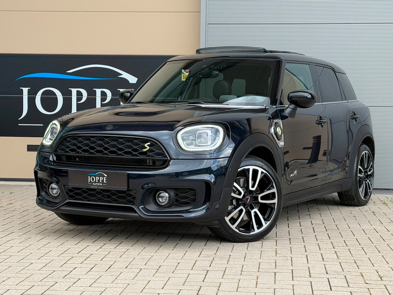 MINI Countryman - 1.5 Cooper S E ALL4 |JCW|Pano|Leder|Headup|Acc|Cam|John Cooper Works|Black optic - AutoWereld.nl