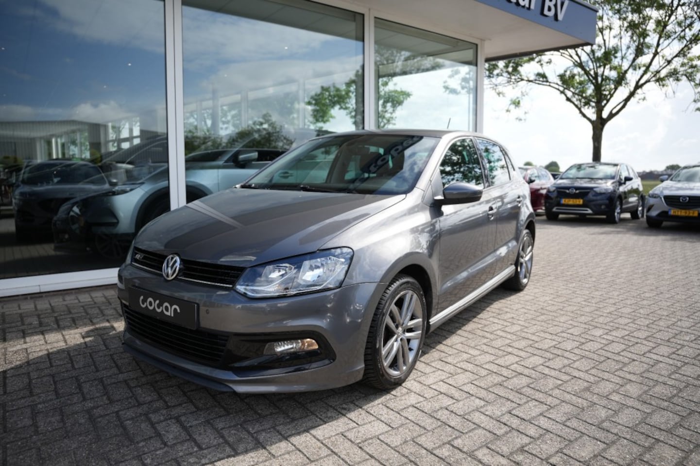Volkswagen Polo - 1.2 TSI HIGHLINE - R line- Navi- PDC - AutoWereld.nl