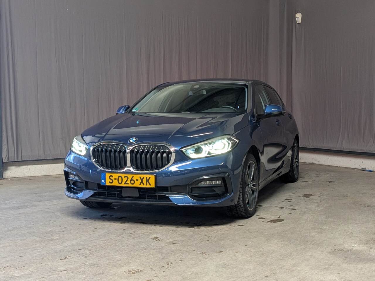 BMW 1-serie - 118i AUTO | Lederen bekleding | Achteruitrijcamera | Cruise control | Navigatie | Stoelver - AutoWereld.nl