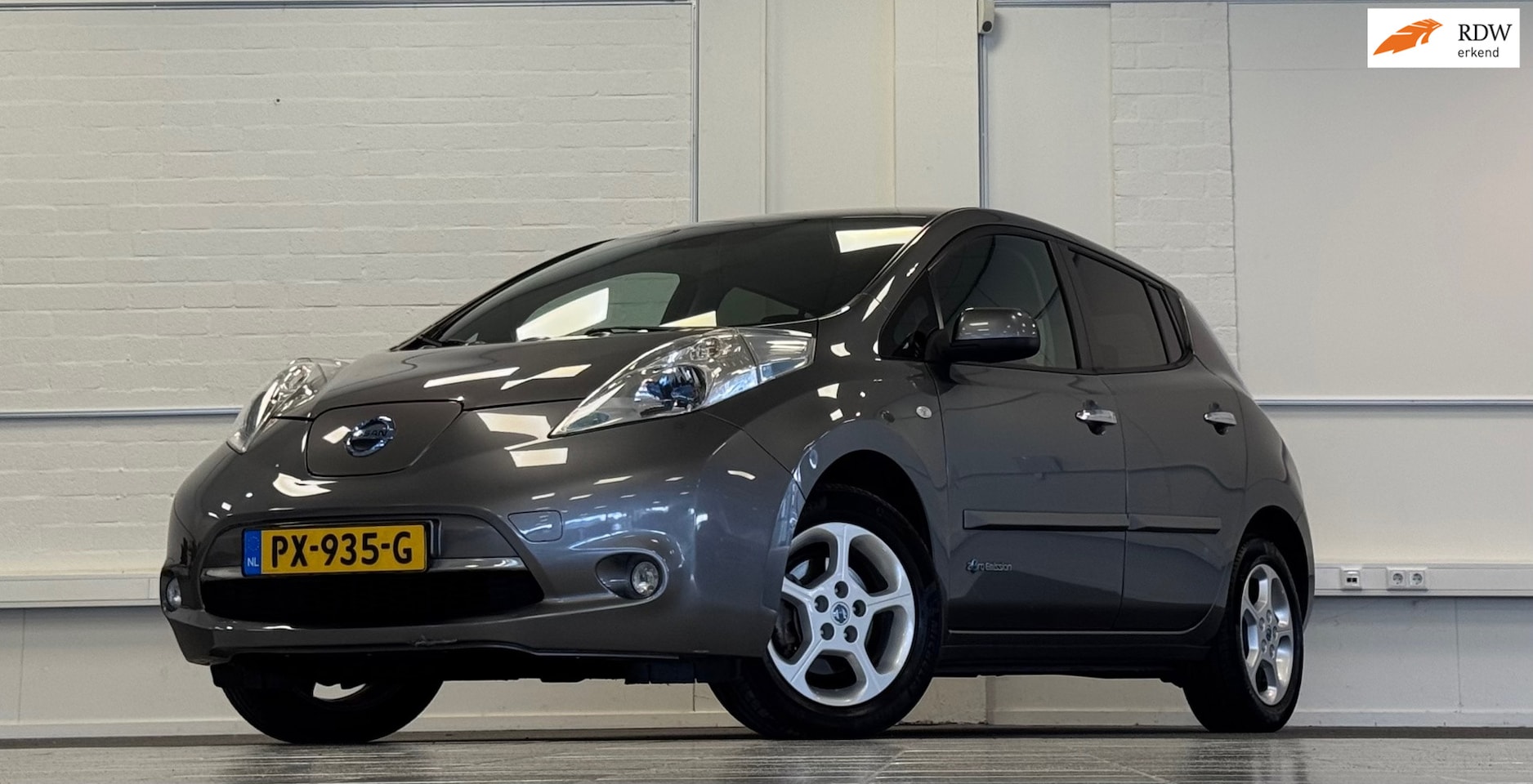 Nissan LEAF - Acenta 24 kWh SOH 82% Navigatie Clima Mooi! - AutoWereld.nl