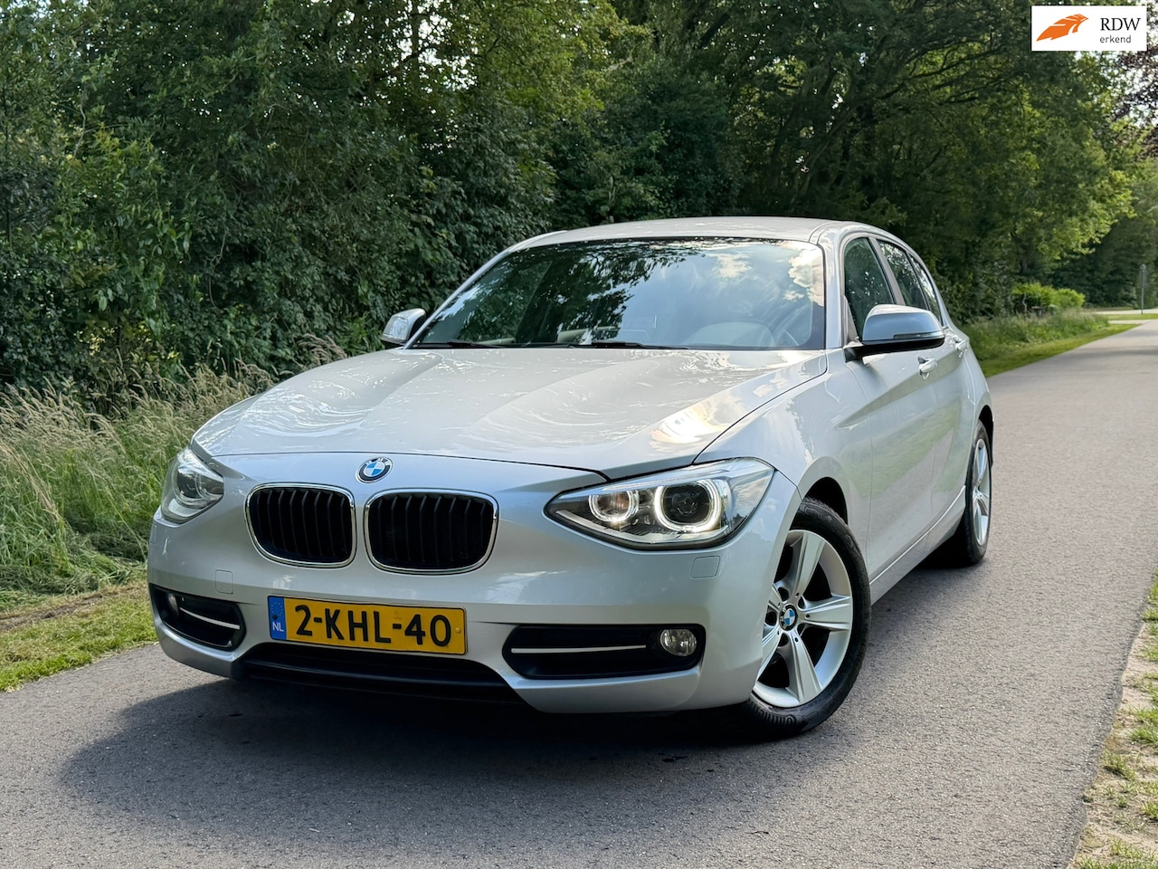 BMW 1-serie - 114i EDE Business Sport | Navi + Cruise + Clima Nu € 5.750,-!!! - AutoWereld.nl