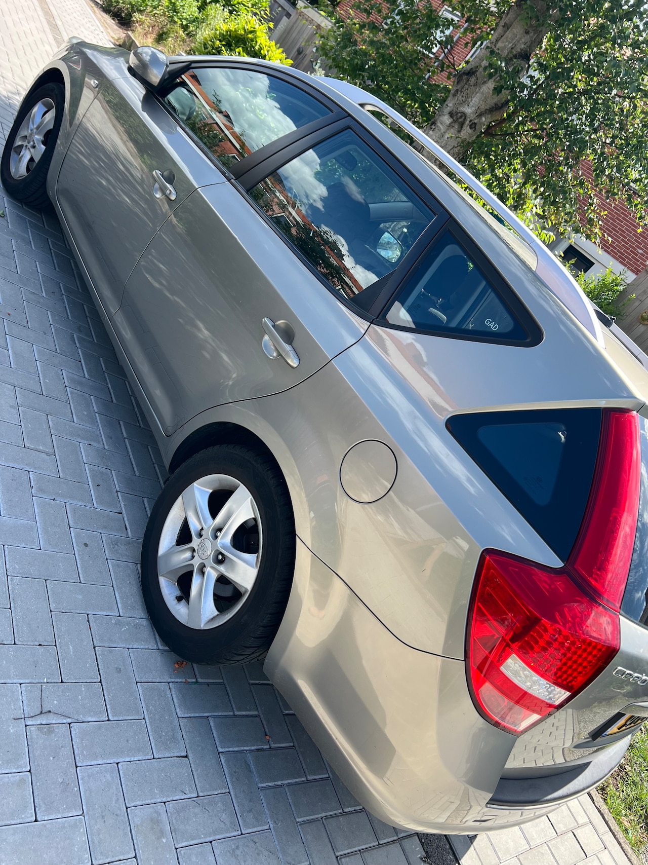 Kia Cee'd Sporty Wagon - 1.4 CVVT Seven - AutoWereld.nl