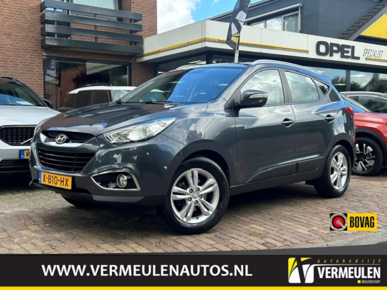 Hyundai ix35 - 1.6i GDI Blue 135PK Business Edition + 17"/ Airco/ Cruise/ Audio/ Bluetooth/ Trekhaak - AutoWereld.nl