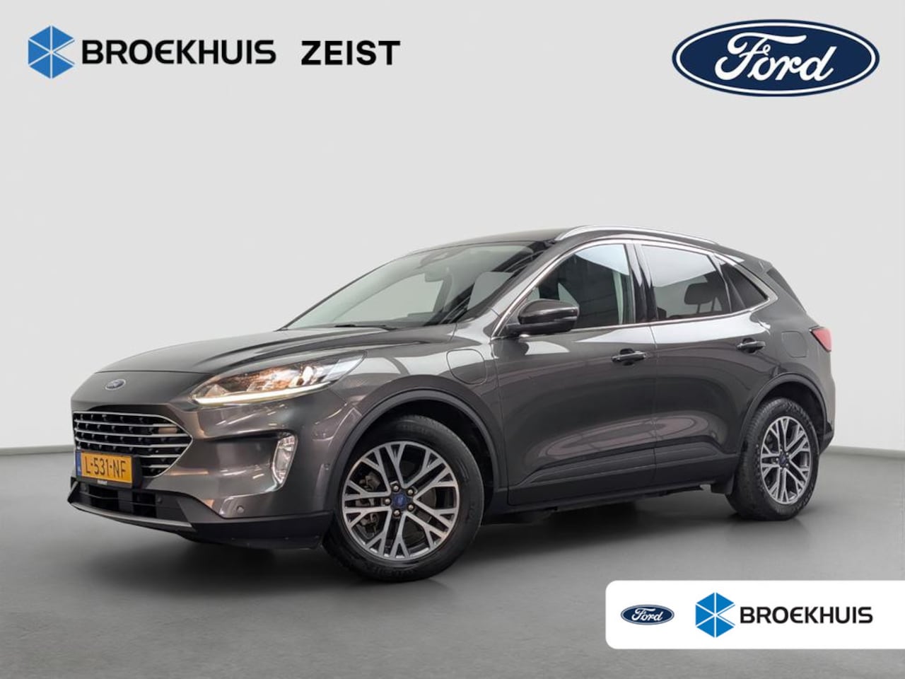 Ford Kuga - 2.5 PHEV Titanium | Dealer o.h. | Adaptieve cruise | Parkeercamera | Standkachel | Electri - AutoWereld.nl