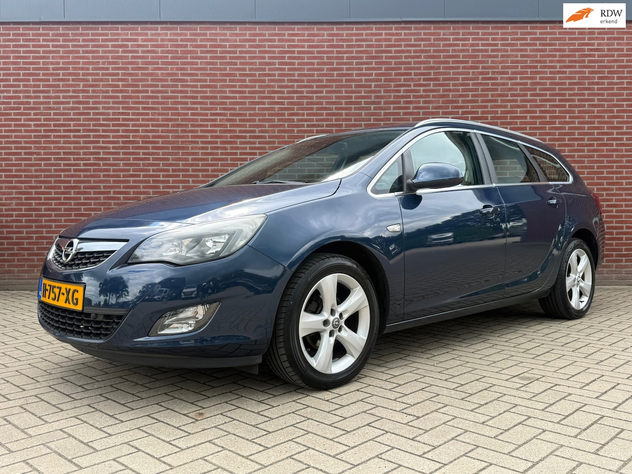 Opel Astra Sports Tourer - 1.4 Turbo Sport / NAP / Cruise / Airco / PDC - AutoWereld.nl
