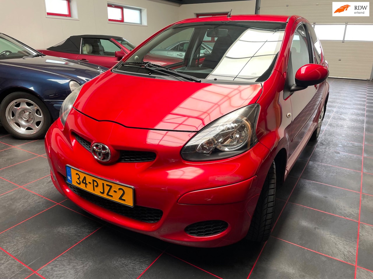 Toyota Aygo - 1.0-12V Aspiration Red Navigator Automaat - AutoWereld.nl