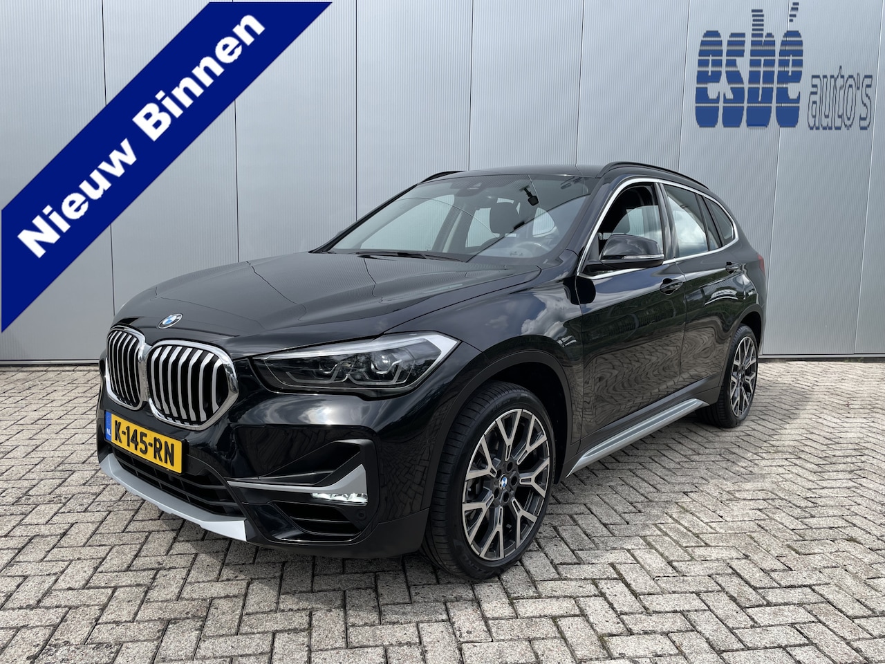 BMW X1 - xDrive20i High Executive X-line Trekhaak Navigatie Zwart Leder Stoelverwarming 19 Inch Vel - AutoWereld.nl