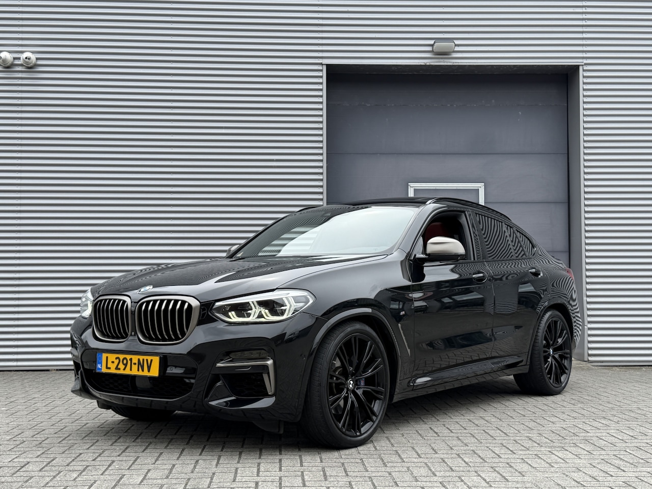 BMW X4 - M40i High Executive I Aut. I 354 PK I Camera I Leder I Pano.dak - AutoWereld.nl