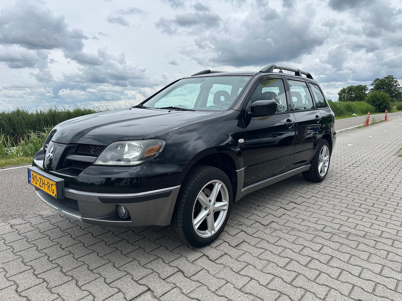 Mitsubishi Outlander - 2.0 Comfort 4WD 2.0 Comfort 4WD, Trekhaak, Airco, Elektrische ramen - AutoWereld.nl