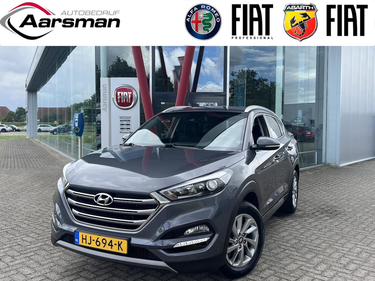 Hyundai Tucson - 1.6 GDi Comfort | Camera | Stoelverwarming | Trekhaak | Navi | Climate control - AutoWereld.nl
