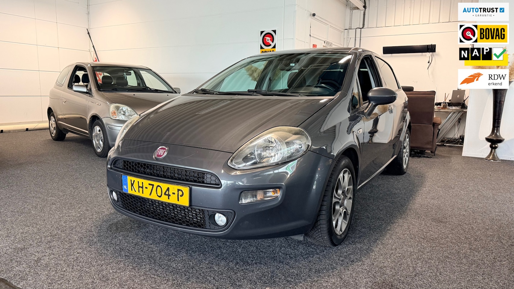 Fiat Punto Evo - 0.9 TwinAir Lounge 0.9 TwinAir Lounge,Cruise control, Airco, Trekhaak - AutoWereld.nl