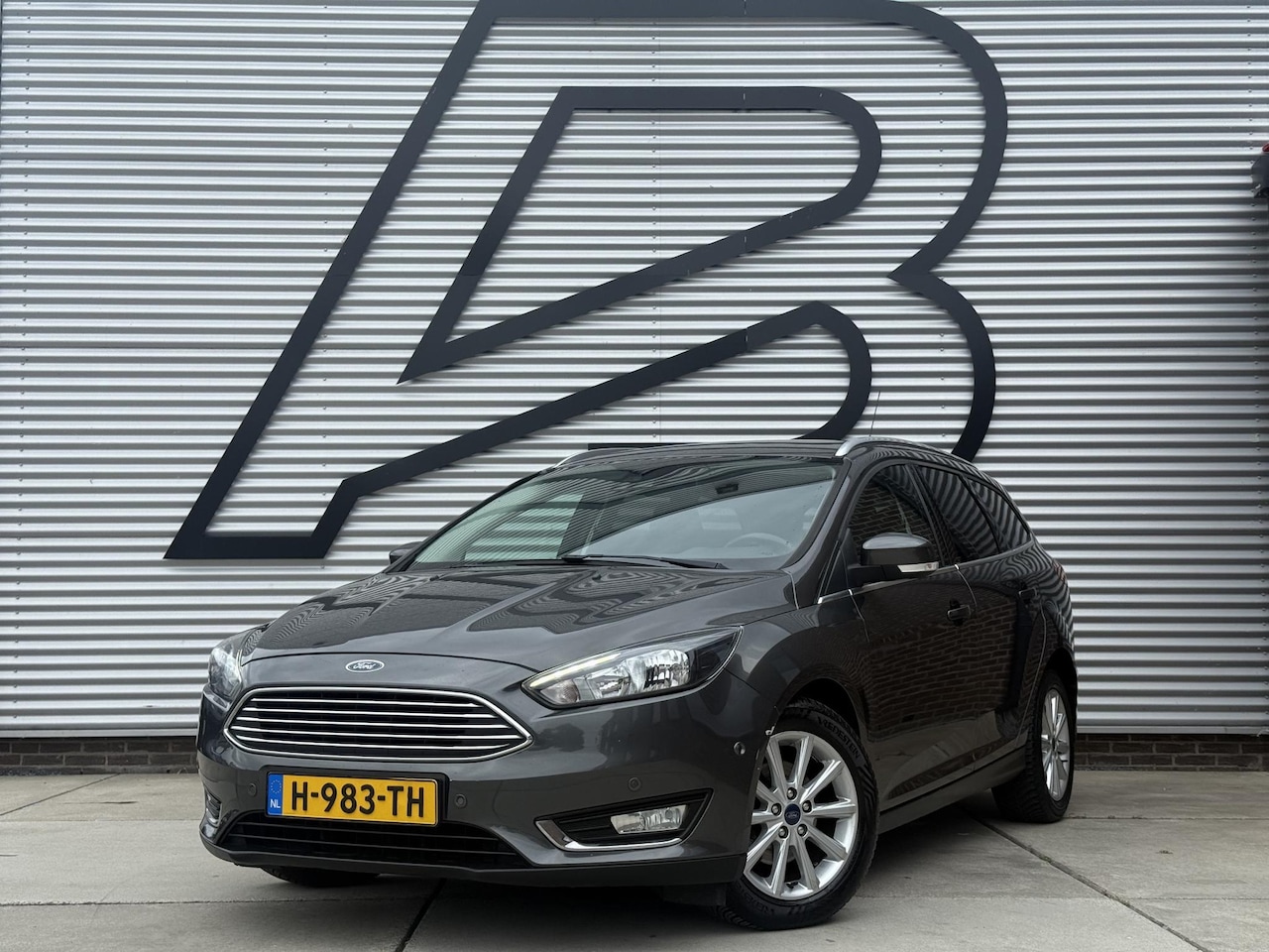 Ford Focus Wagon - 1.0 Titanium 1e Eigenaar|Navi|Clima|Cruise|Carplay|Stoel+Stuur verw|PDC V+A|APK tot 12-202 - AutoWereld.nl