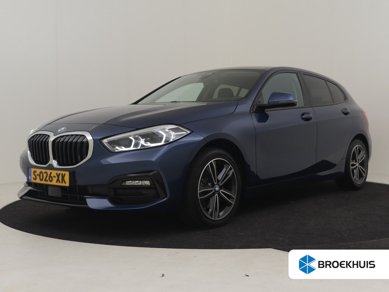 BMW 1-serie - 118i AUTO | Half lederen bekleding | Achteruitrijcamera | Cruise control | Navigatie | Sto - AutoWereld.nl