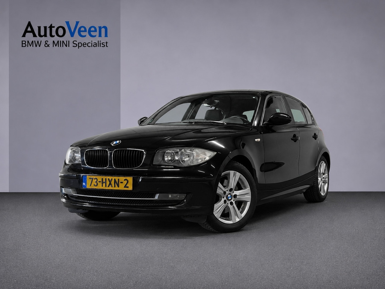 BMW 1-serie - 118i Business Line (PARKEERSENSOREN, TREKHAAK, GOED ONDERHOUDEN) - AutoWereld.nl