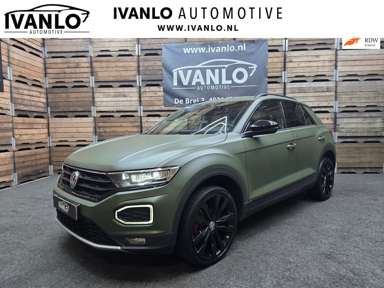 Volkswagen T-Roc - 1.5 TSI Sport Navi VCP Clima Cruise Camera 19"LM Darkgreen Wrap 200PK! - AutoWereld.nl