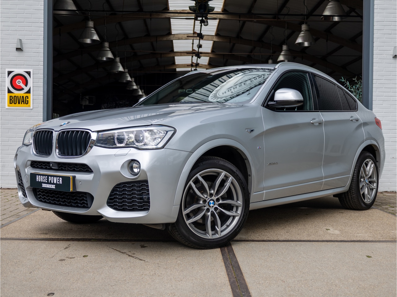 BMW X4 - xDrive20i High Executive M Sport Edition *Trekhaak | Leder | NL Auto | Keyless | Memory | - AutoWereld.nl