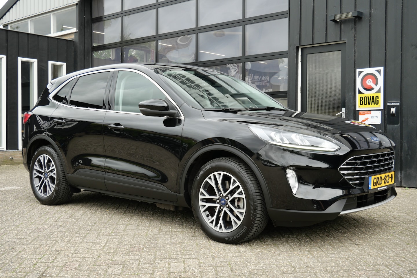 Ford Kuga - 2.5 PHEV Titanium | Keyless | Carplay | 18'' | Stoel + Stuur Verwarming - AutoWereld.nl