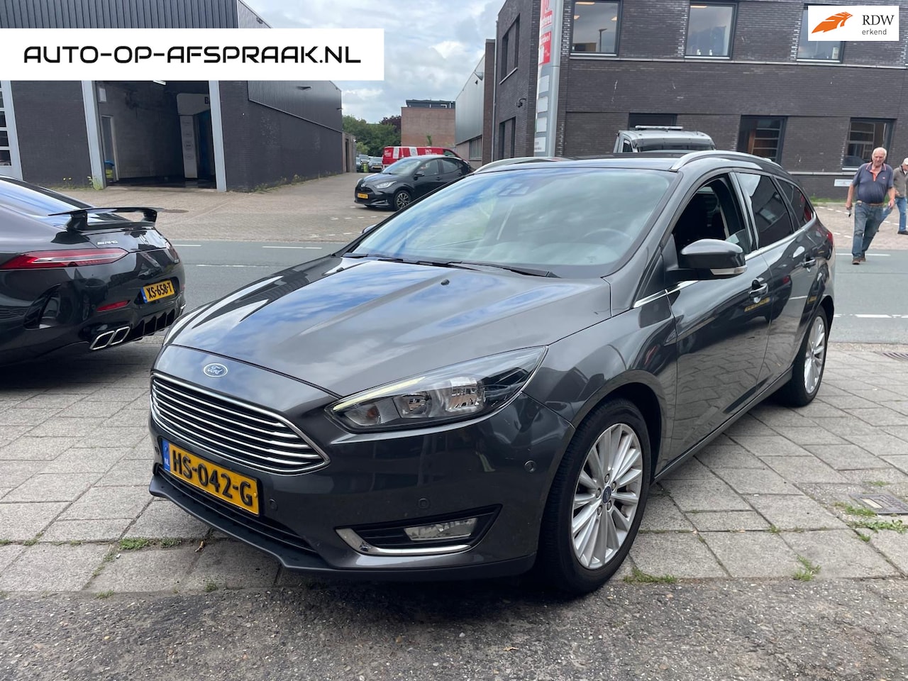 Ford Focus Wagon - 1.0 Titanium Navi Clima Cruise Stoelv. PDC - AutoWereld.nl