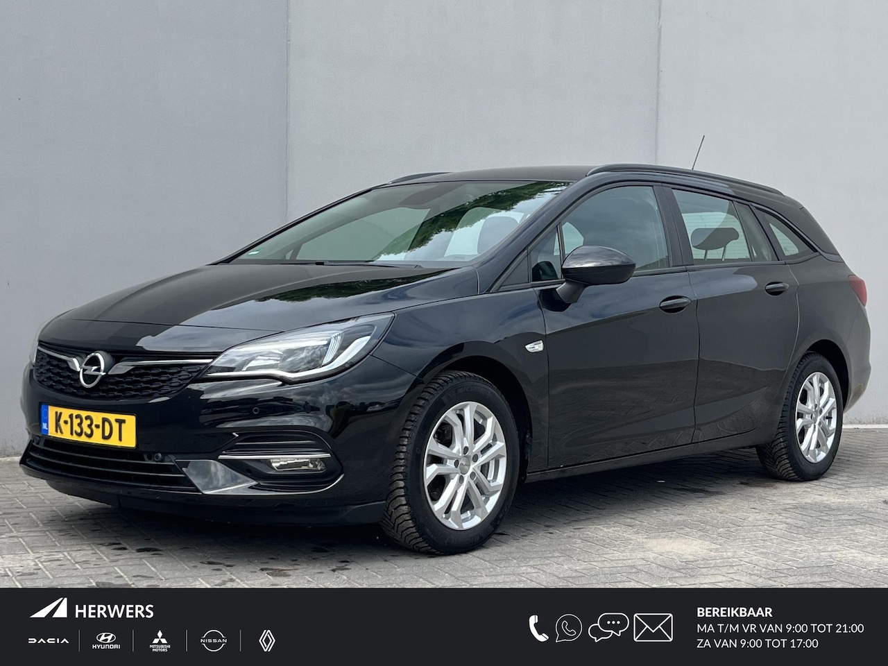 Opel Astra Sports Tourer - 1.2 Business Executive Lichtmetalen velgen / Achteruitrijcamera / Navigatie /  Apple Carpl - AutoWereld.nl