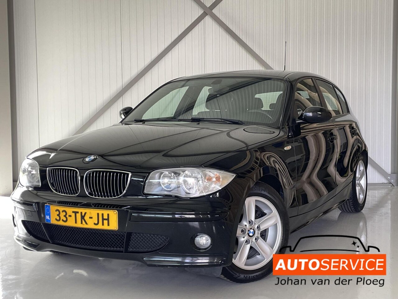 BMW 1-serie - 116i Executive zwart CRUISE / AIRCO - AutoWereld.nl