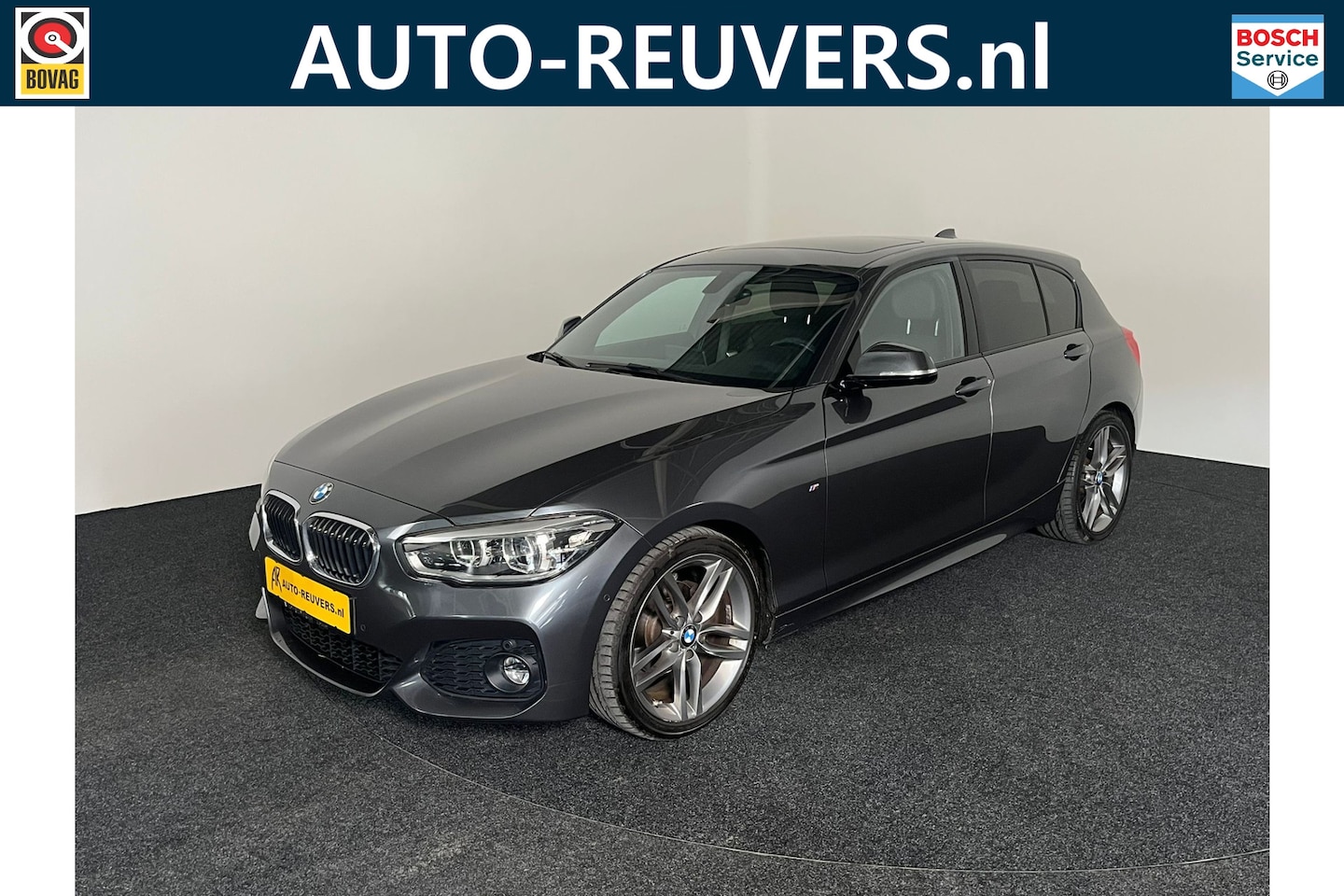 BMW 1-serie - 118i M-Sport High Executive / Panorama / Camera / Navigatie / LED - AutoWereld.nl