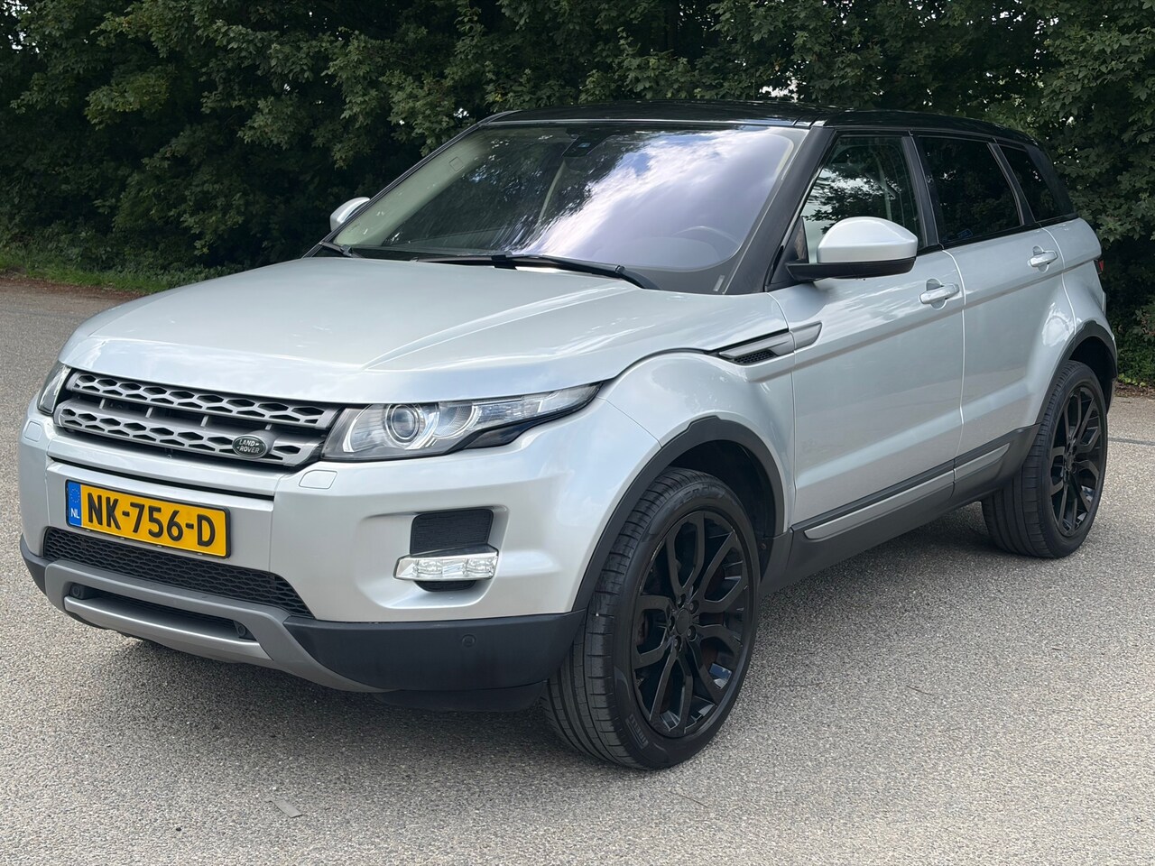 Land Rover Range Rover Evoque - 2.0 Si 4WD Sicilian Yellow 2.0 Si 4WD Sicilian Yellow - AutoWereld.nl