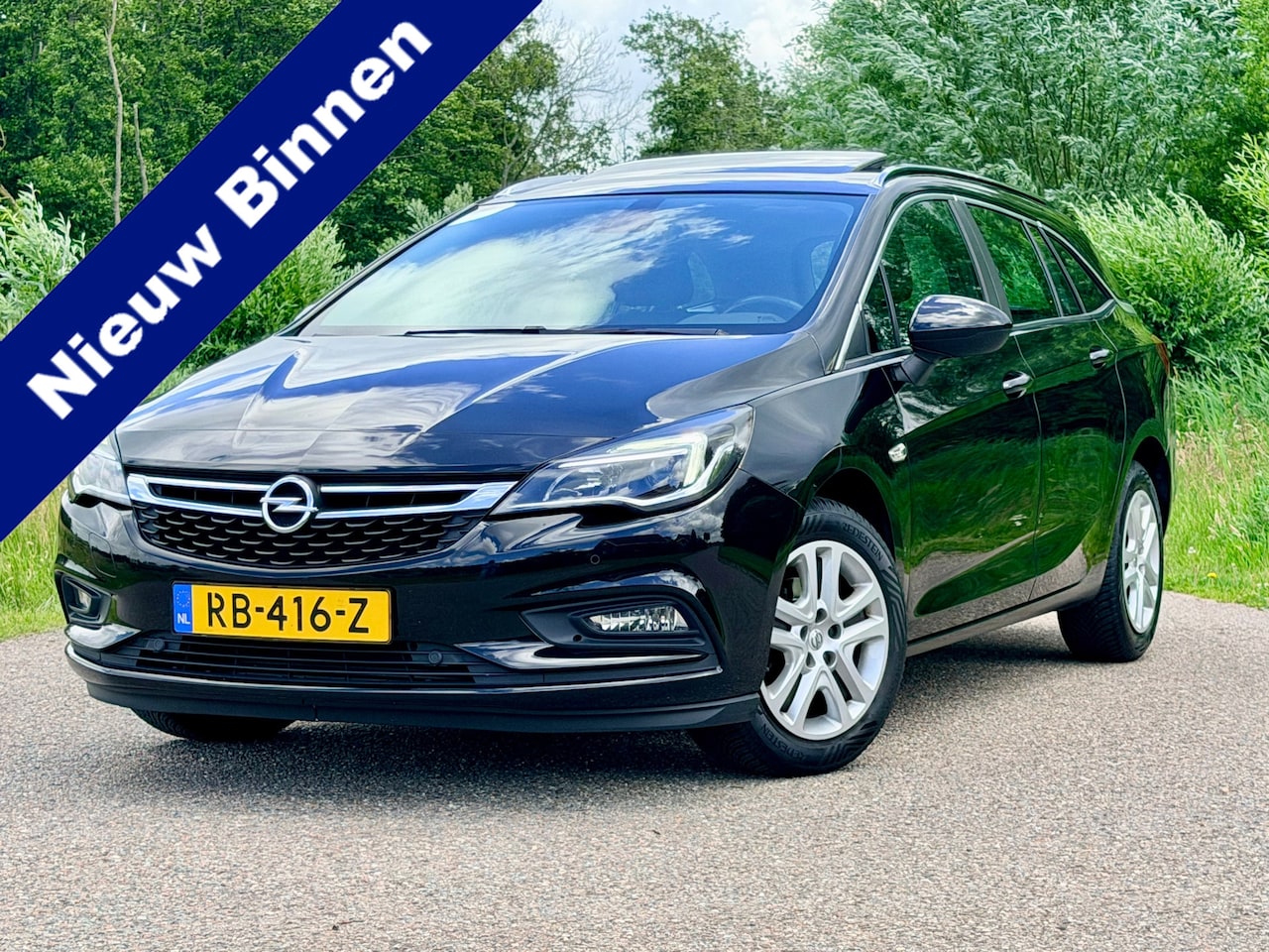 Opel Astra Sports Tourer - 1.0 Business+ / Clima / Navi / Svhuifdak / CC / Verwarmde Stuur en Voorstoelen / PDC / 2de - AutoWereld.nl
